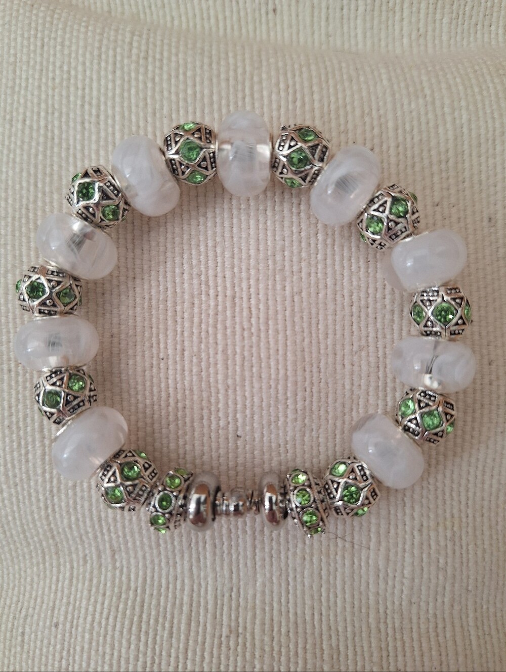 White And Clear Marbled Glass Beads and Green Silver Encased Gem Stone Bracelet.